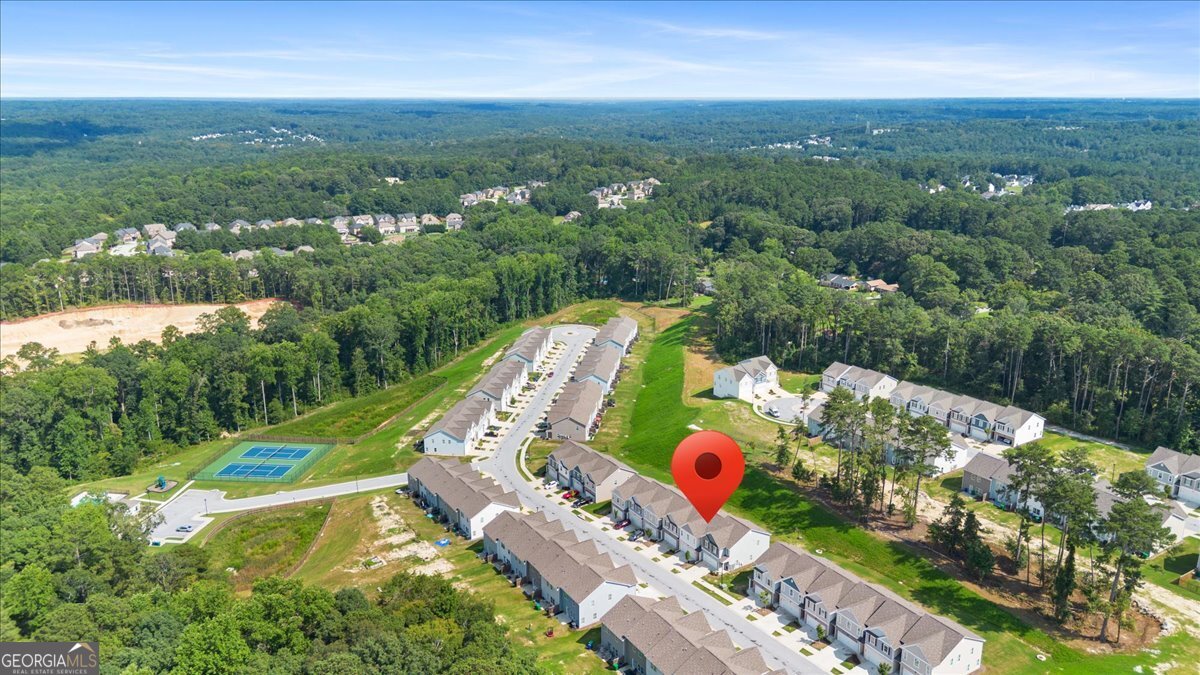 7503 Knoll Hollow Road Lithonia, GA 30058 - Photo 33 of 34 an aerial view of house with yard and mountain view in back