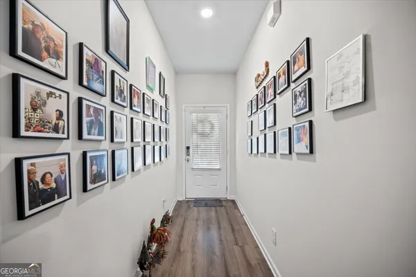 a view of a livingroom with furniture and stairs