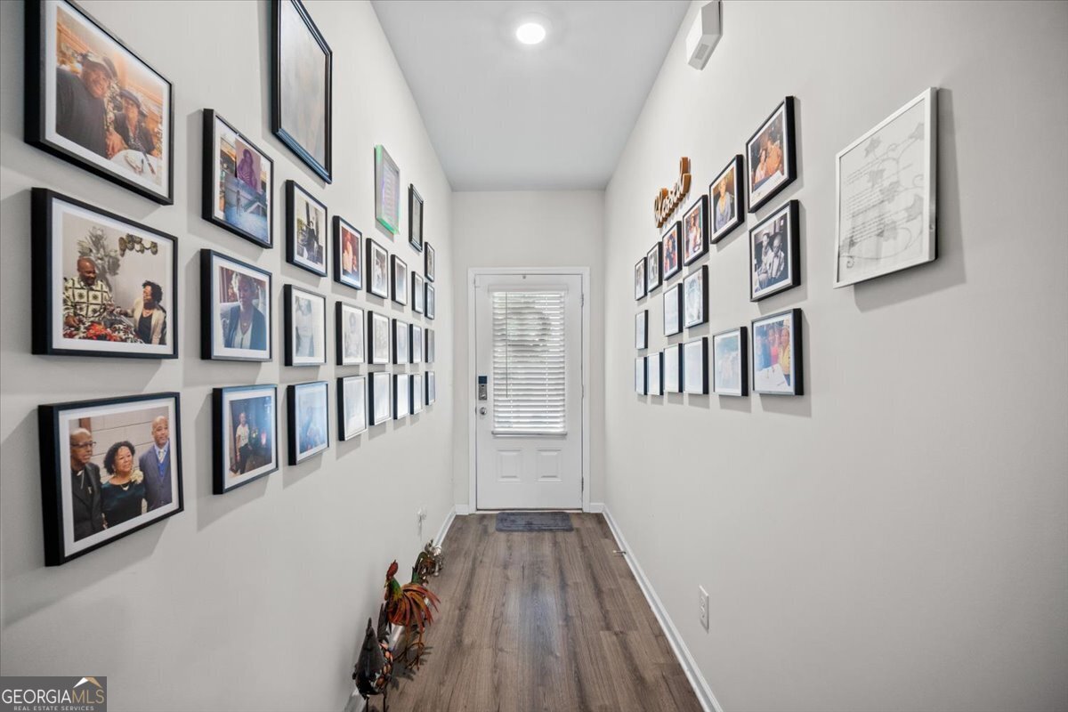 7503 Knoll Hollow Road Lithonia, GA 30058 - Photo 5 of 34 a view of a livingroom with furniture and stairs