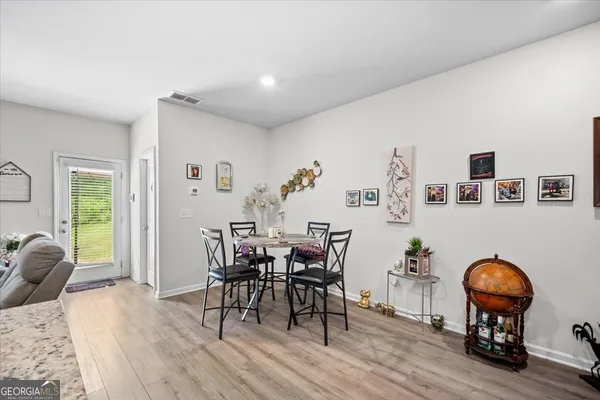 a view of a livingroom with furniture and wooden floor