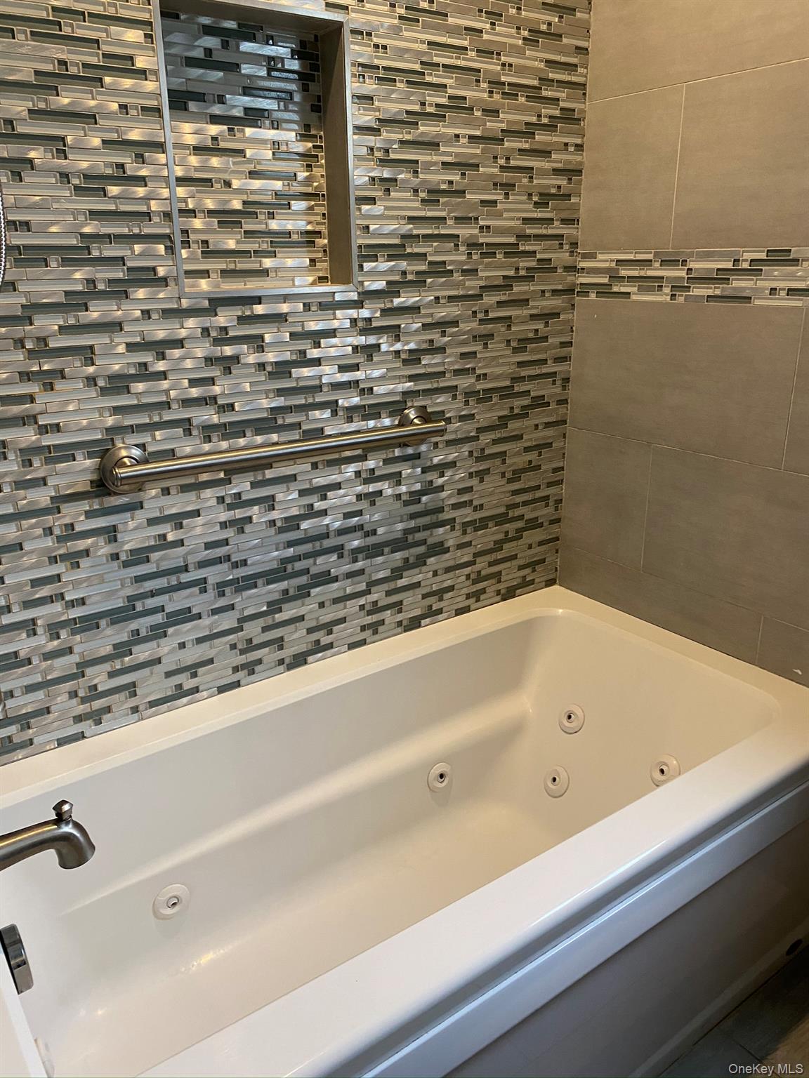 25 Woodhollow Road Albertson, NY 11507 - Photo 11 of 15 a bathroom with a bathtub and shower