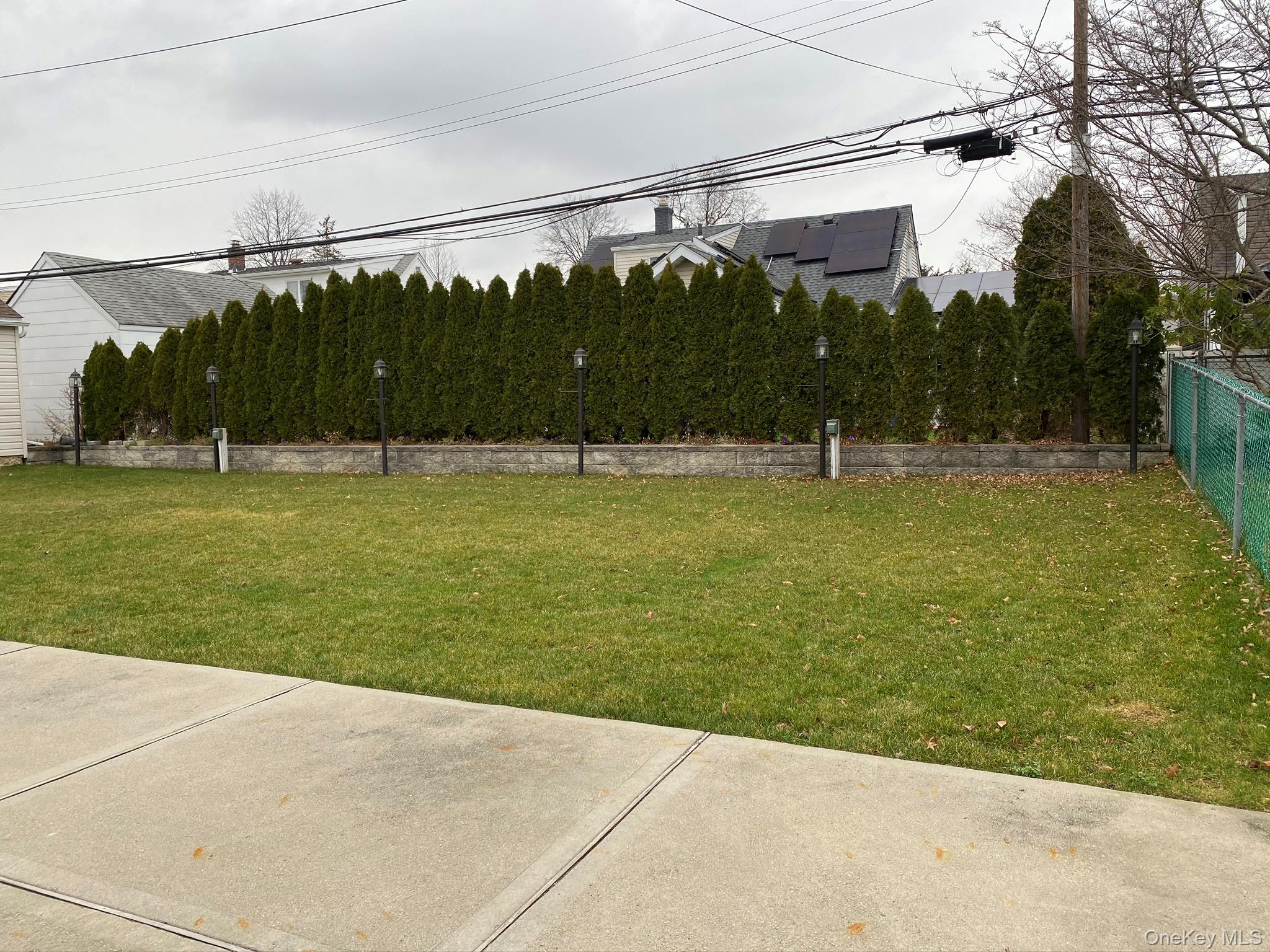 25 Woodhollow Road Albertson, NY 11507 - Photo 13 of 15 a view of a yard