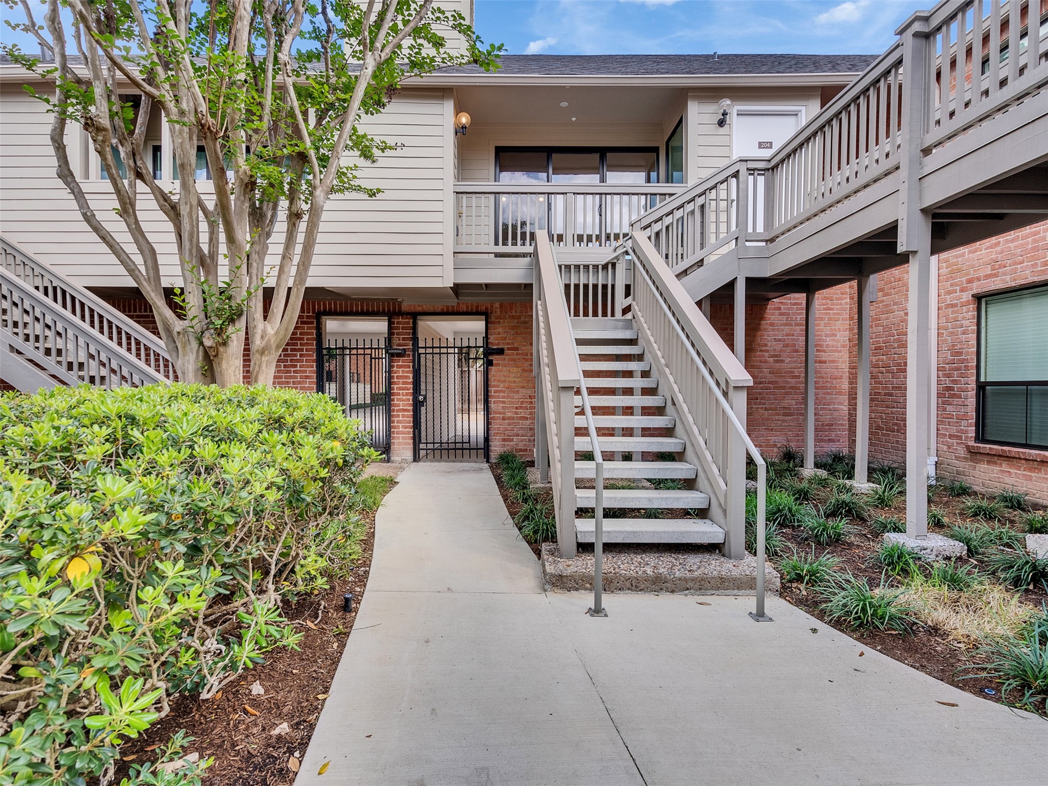 2829 Timmons Lane, Unit 204 Houston, TX 77027 - Photo 1 of 32 a view of a house with backyard and stairs