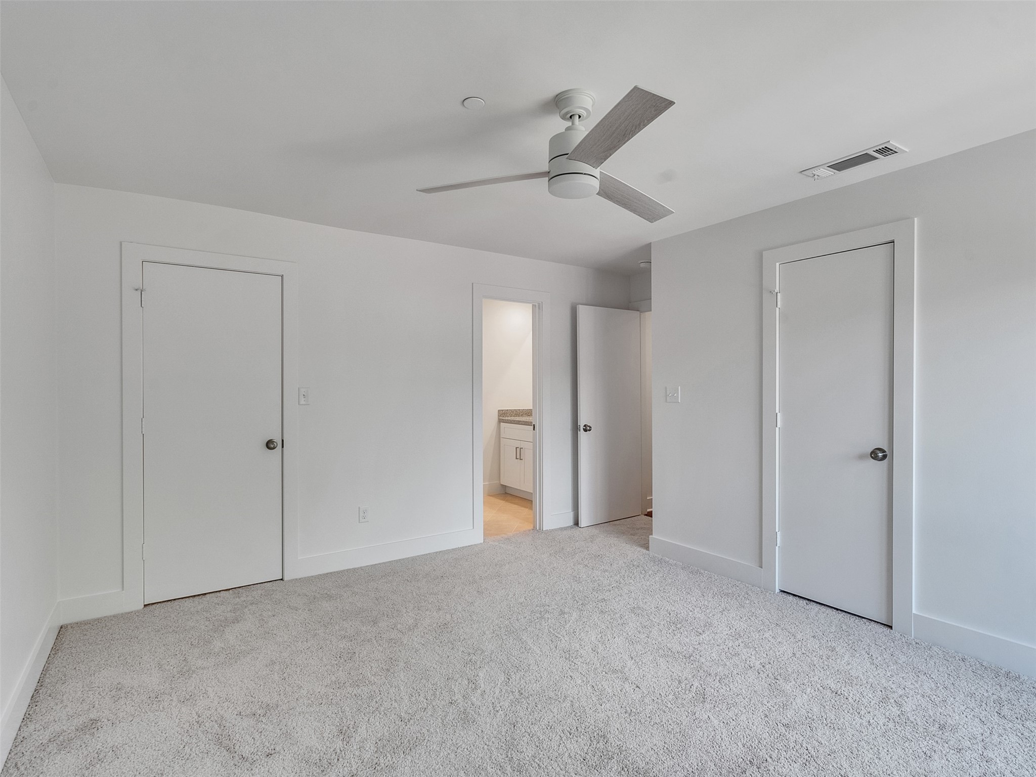 2829 Timmons Lane, Unit 204 Houston, TX 77027 - Photo 20 of 32 a view of an empty room and chandelier fan