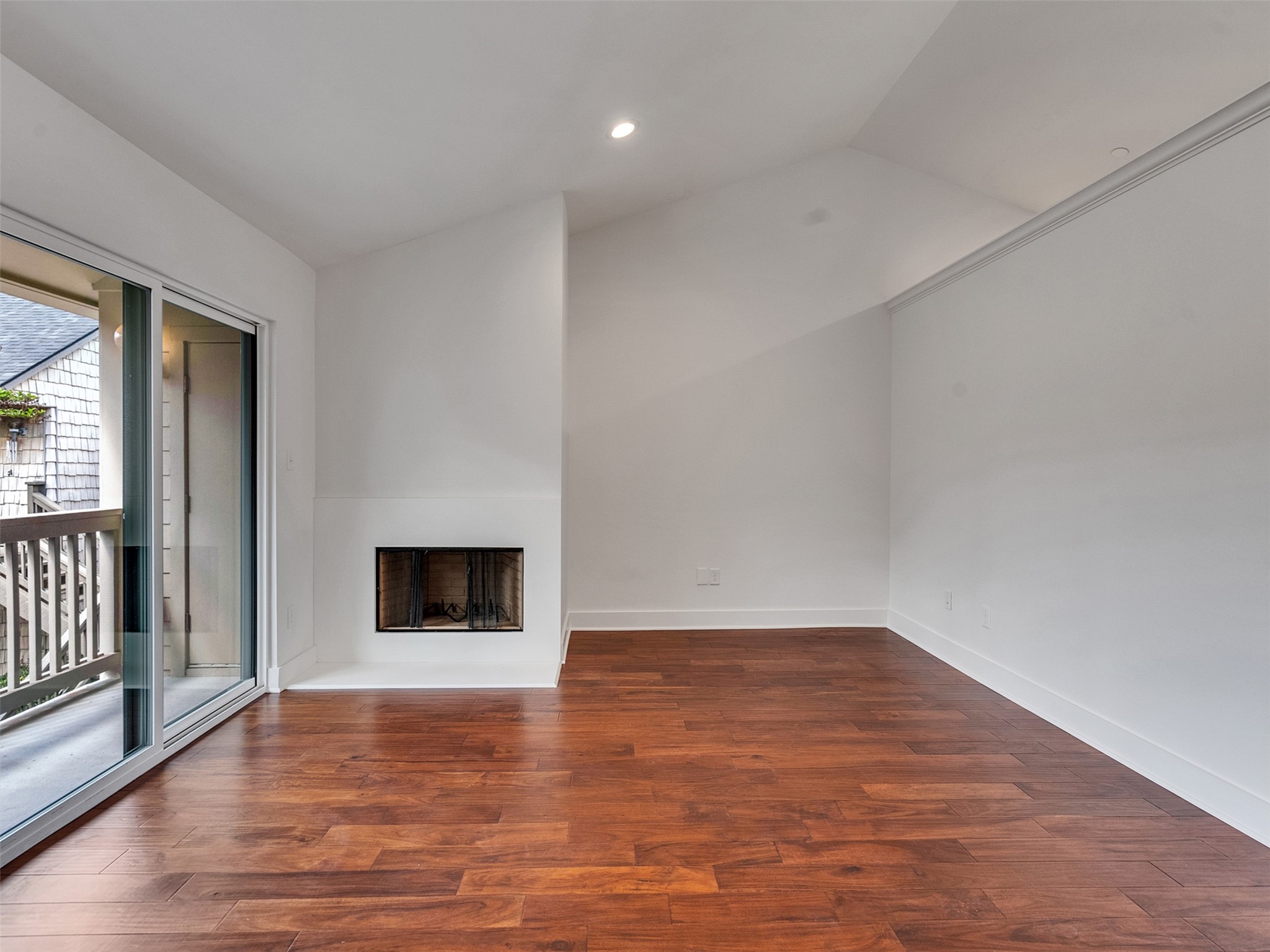2829 Timmons Lane, Unit 204 Houston, TX 77027 - Photo 22 of 32 a view of an empty room with wooden floor and a window