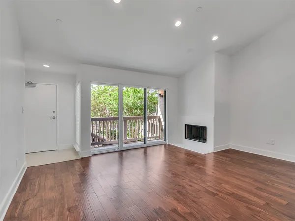 a house view with a sitting space fire pit and outdoor space