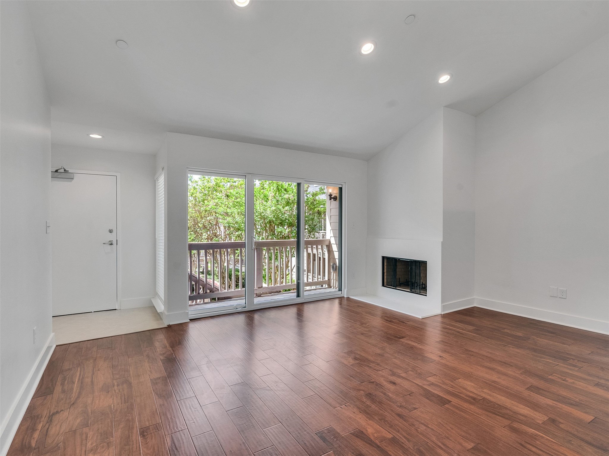 2829 Timmons Lane, Unit 204 Houston, TX 77027 - Photo 23 of 32 a view of an empty room with wooden floor and a window