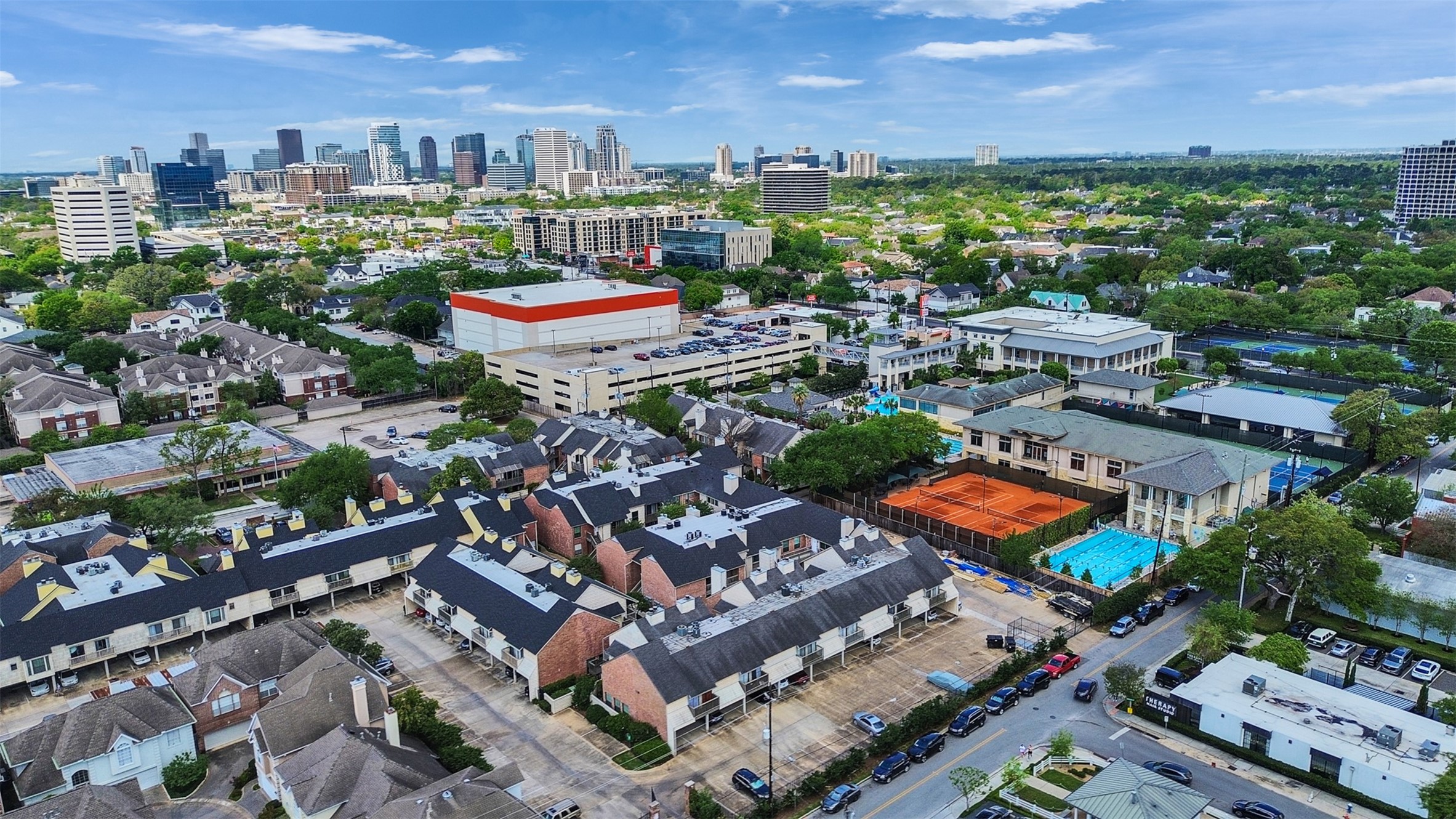 2829 Timmons Lane, Unit 204 Houston, TX 77027 - Photo 31 of 32 an aerial view of a city with lots of residential buildings ocean and mountain view in back