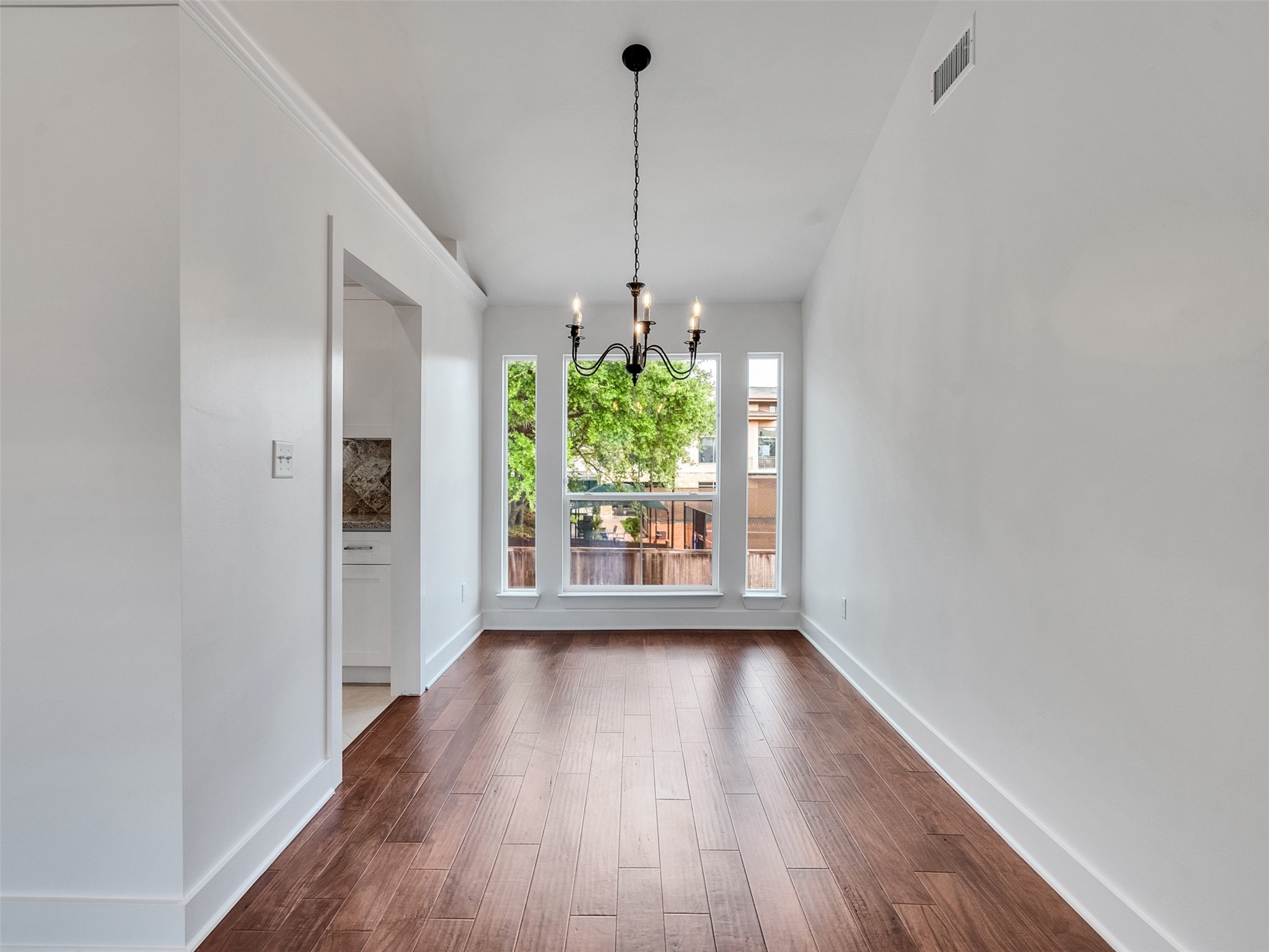 2829 Timmons Lane, Unit 204 Houston, TX 77027 - Photo 9 of 32 a view of a room with window and wooden floor