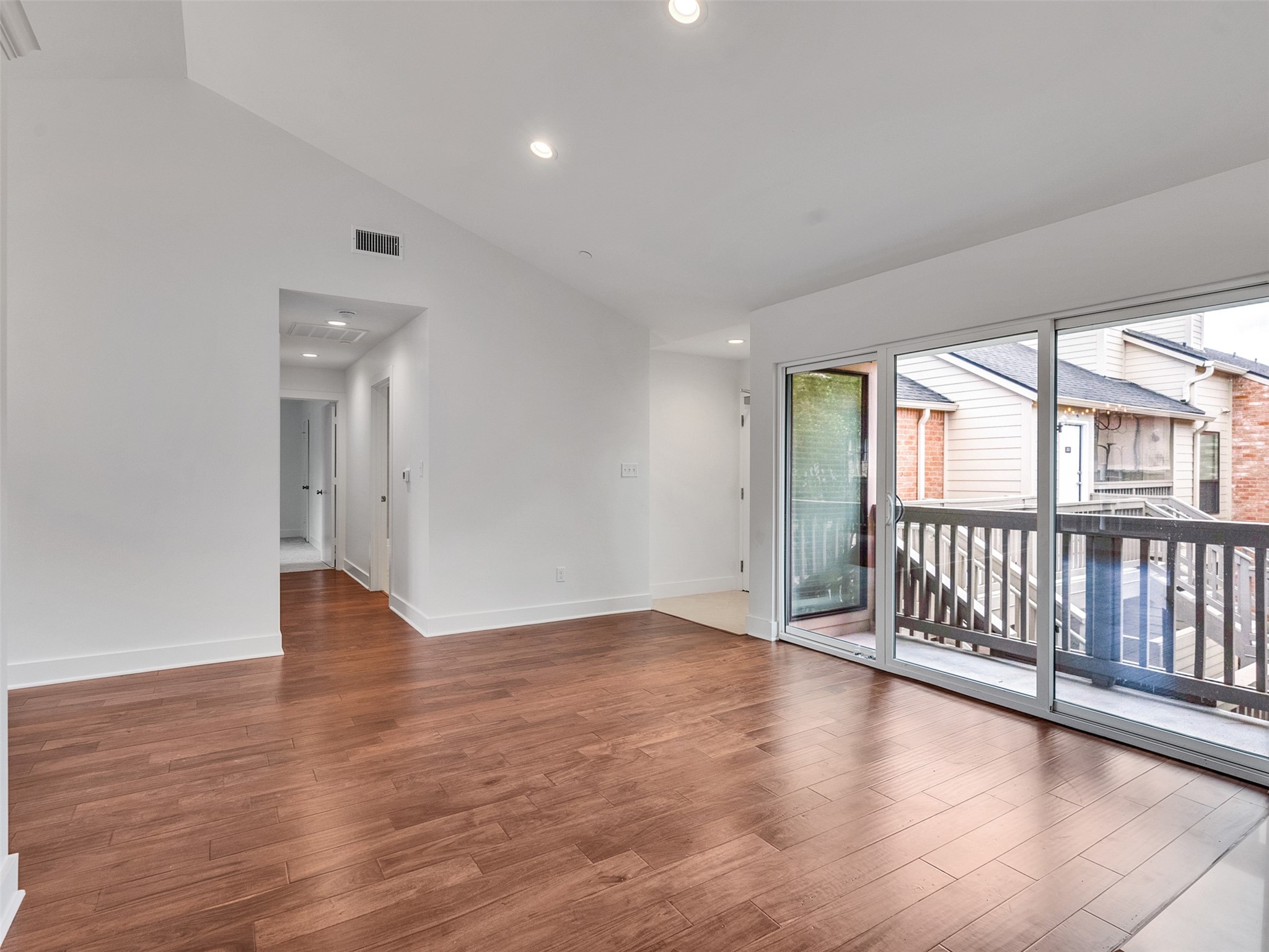 2829 Timmons Lane, Unit 204 Houston, TX 77027 - Photo 10 of 32 wooden floor in an empty room with a window