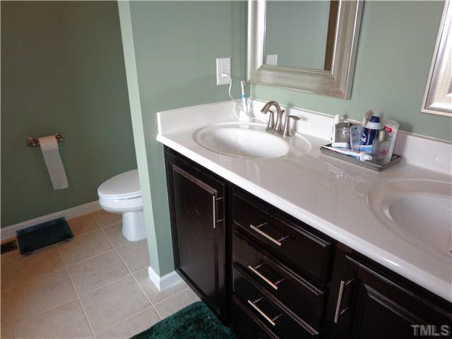 1537 Rodessa Run Raleigh, NC 27607 - Photo 15 of 25 Master bath with dual vanity and tile floor.