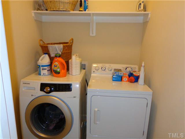1537 Rodessa Run Raleigh, NC 27607 - Photo 20 of 25 3rd floor utility room with clothes rod and shelf.