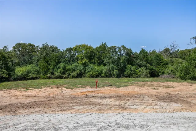 a view of a street with a bench