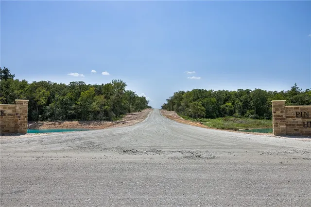 a view of a pathway with a lake