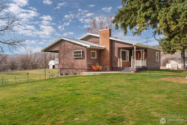 a front view of house with yard and seating area