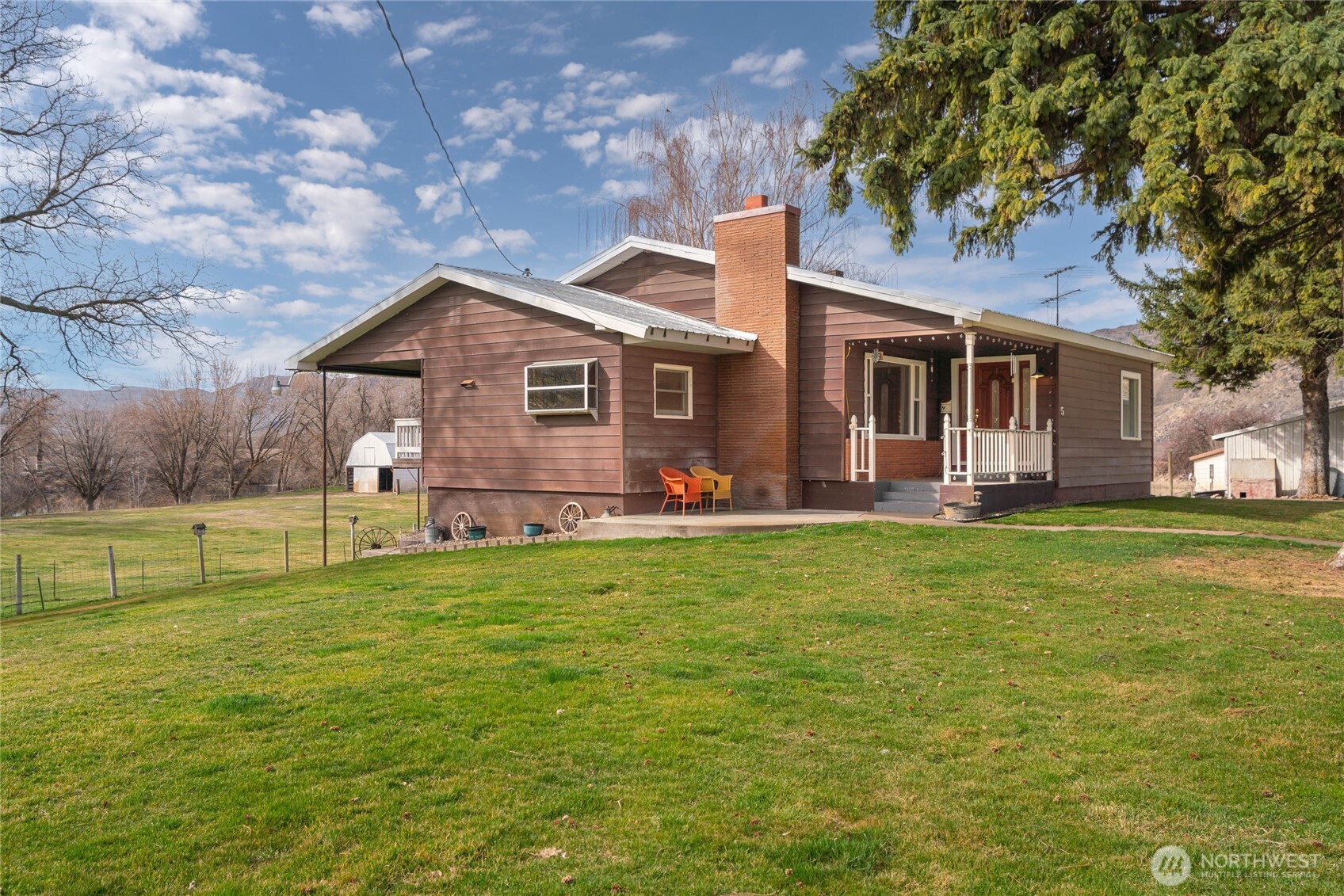 a front view of house with yard and seating area