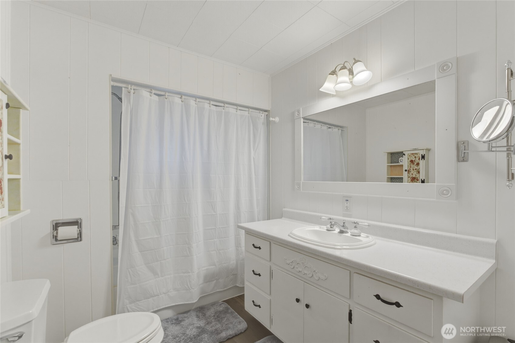 5 Alaska Street Malott, WA 98829 - Photo 21 of 38 a bathroom with a sink a toilet a mirror a vanity and shower