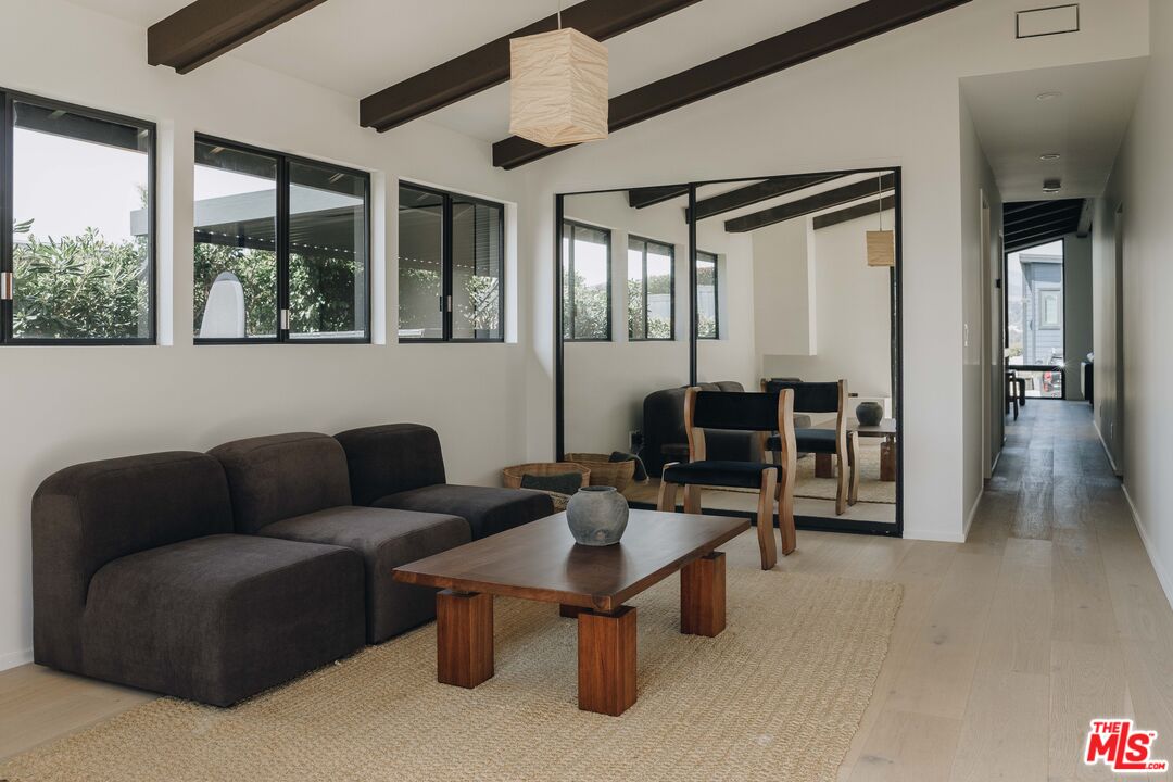 29500 Heathercliff Road, Unit 220 Malibu, CA 90265 - Photo 17 of 43 a living room with furniture and a large window