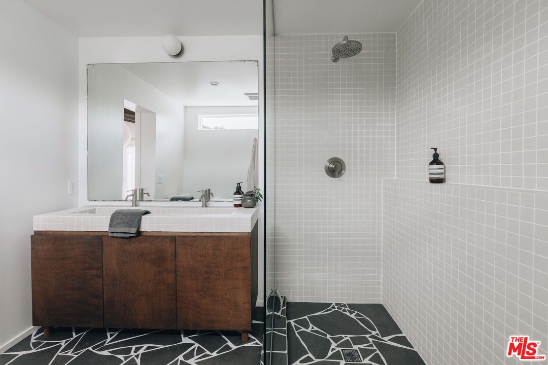 29500 Heathercliff Road, Unit 220 Malibu, CA 90265 - Photo 22 of 43 a bathroom with a sink toilet and shower