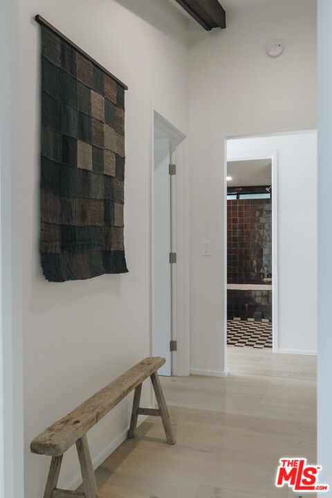 29500 Heathercliff Road, Unit 220 Malibu, CA 90265 - Photo 26 of 43 a room with a bench and mirror