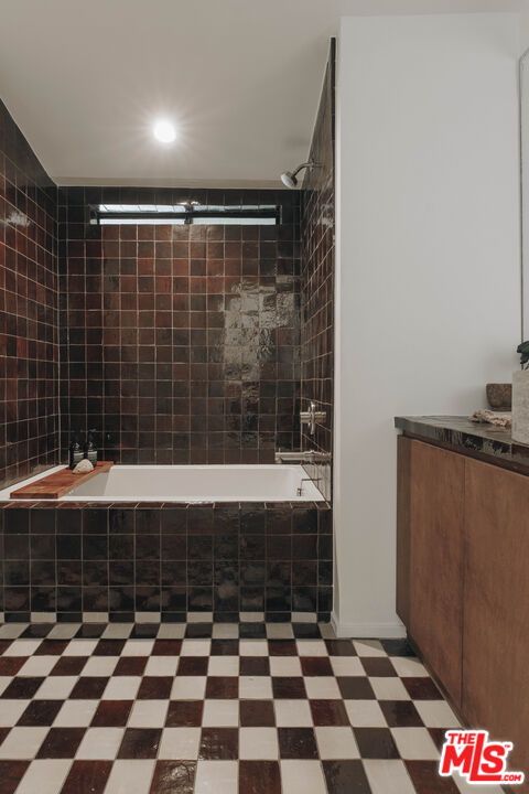 29500 Heathercliff Road, Unit 220 Malibu, CA 90265 - Photo 28 of 43 a bathroom with a black and white checkered floor