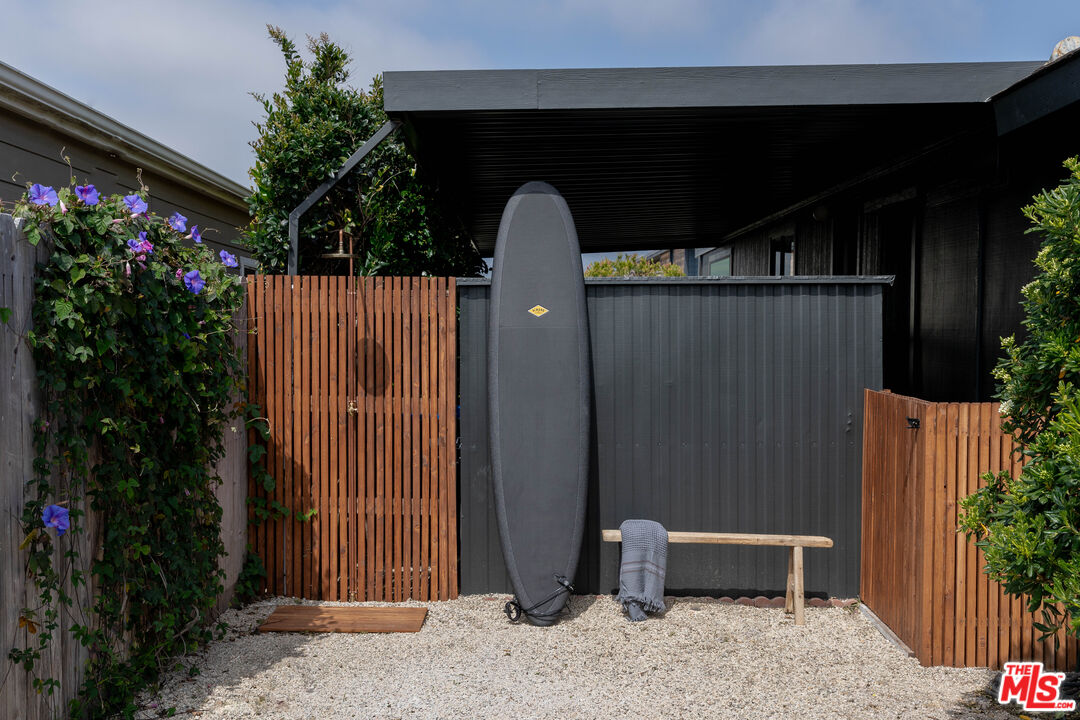 29500 Heathercliff Road, Unit 220 Malibu, CA 90265 - Photo 34 of 43 a front view of a house with garden