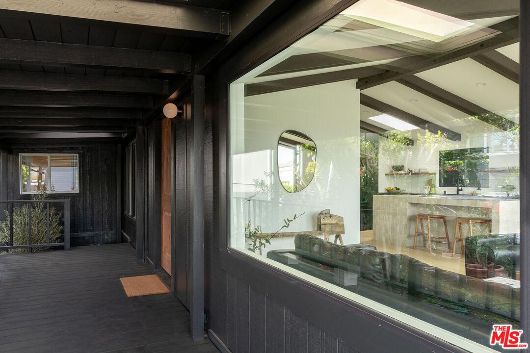 29500 Heathercliff Road, Unit 220 Malibu, CA 90265 - Photo 4 of 43 a view of living room and kitchen with furniture