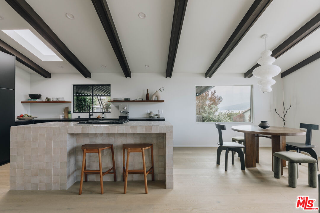 29500 Heathercliff Road, Unit 220 Malibu, CA 90265 - Photo 10 of 43 a kitchen with furniture a counter top space and appliances