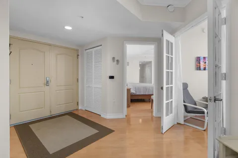 a view of a hallway with bathroom