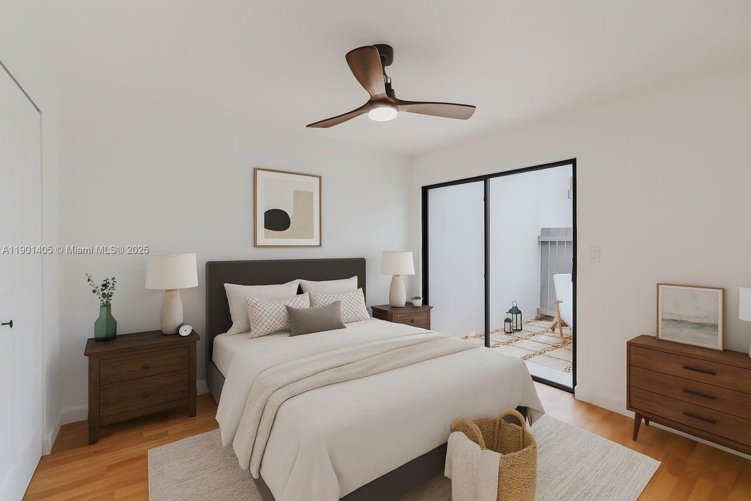 7354 Southwest 105th Place Miami, FL 33173 - Photo 11 of 15 a bedroom with a bed and wooden floor
