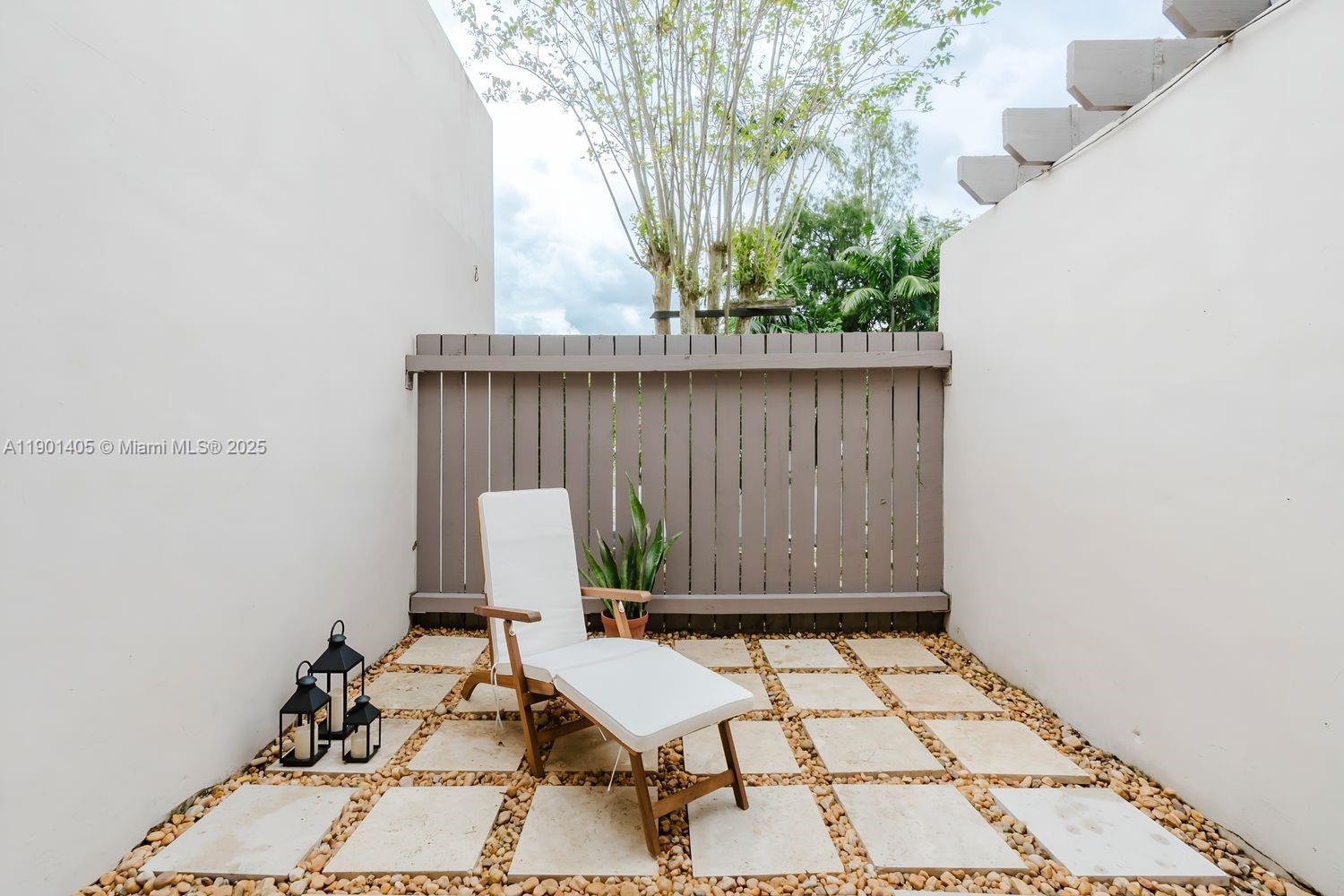 7354 Southwest 105th Place Miami, FL 33173 - Photo 12 of 15 view of backyard with a table and chair