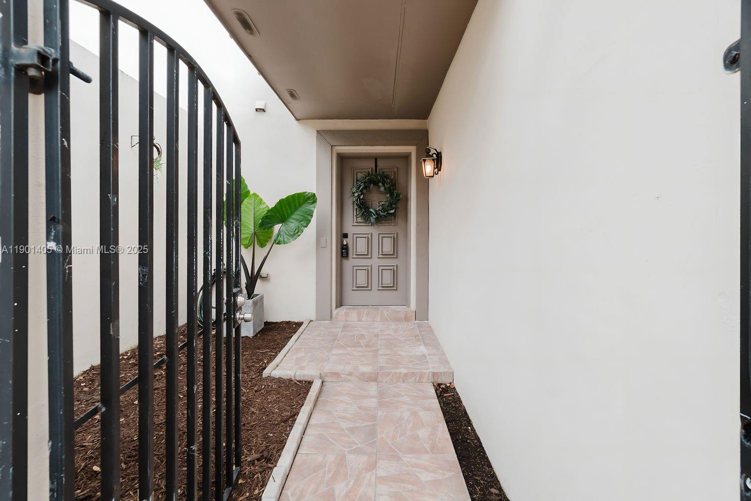 7354 Southwest 105th Place Miami, FL 33173 - Photo 13 of 15 a view of a hallway with wooden floor and a potted plant