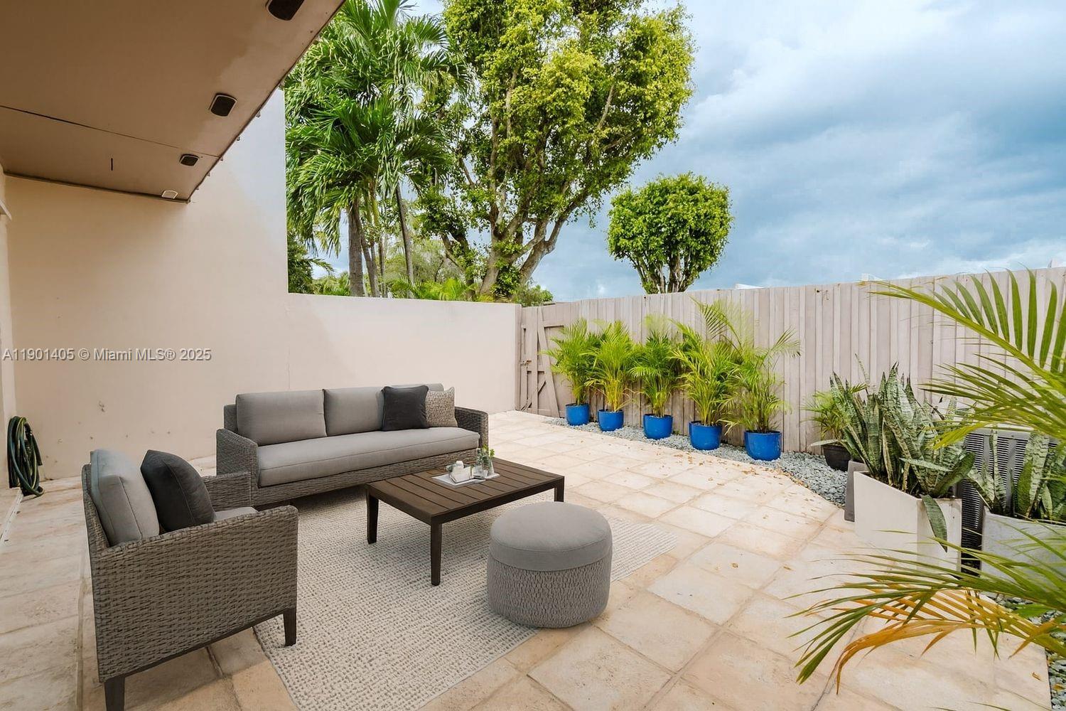 7354 Southwest 105th Place Miami, FL 33173 - Photo 5 of 15 a view of a patio with plants and a potted plant