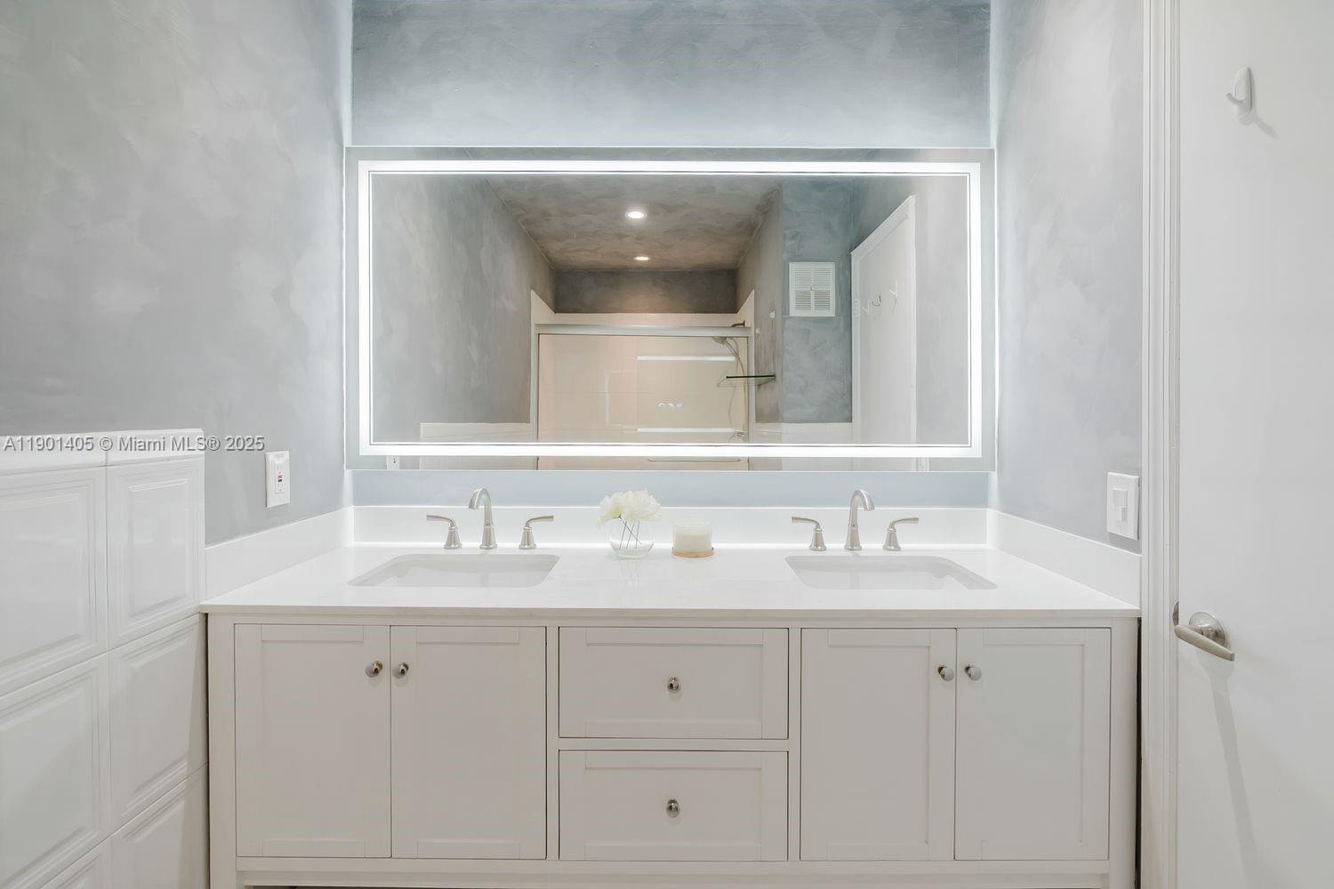 7354 Southwest 105th Place Miami, FL 33173 - Photo 9 of 15 a bathroom with a sink vanity and mirror