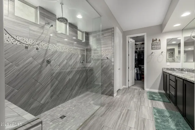 a view of a bathroom with a sink and a shower