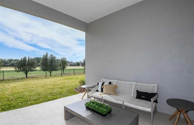 a view of a garden with lawn chairs