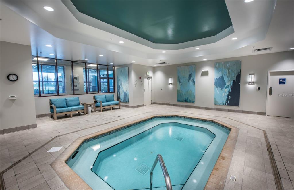 8372 Southwest 58 Loop Ocala, FL 34481 - Photo 21 of 30 a large swimming pool with view of kitchen and living room