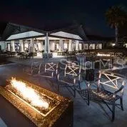 a view of a swimming pool with outdoor seating