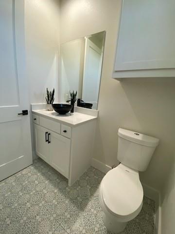 3230 Elihu Street, Unit 2 Dallas, TX 75210 - Photo 11 of 20 a bathroom with a toilet sink and mirror