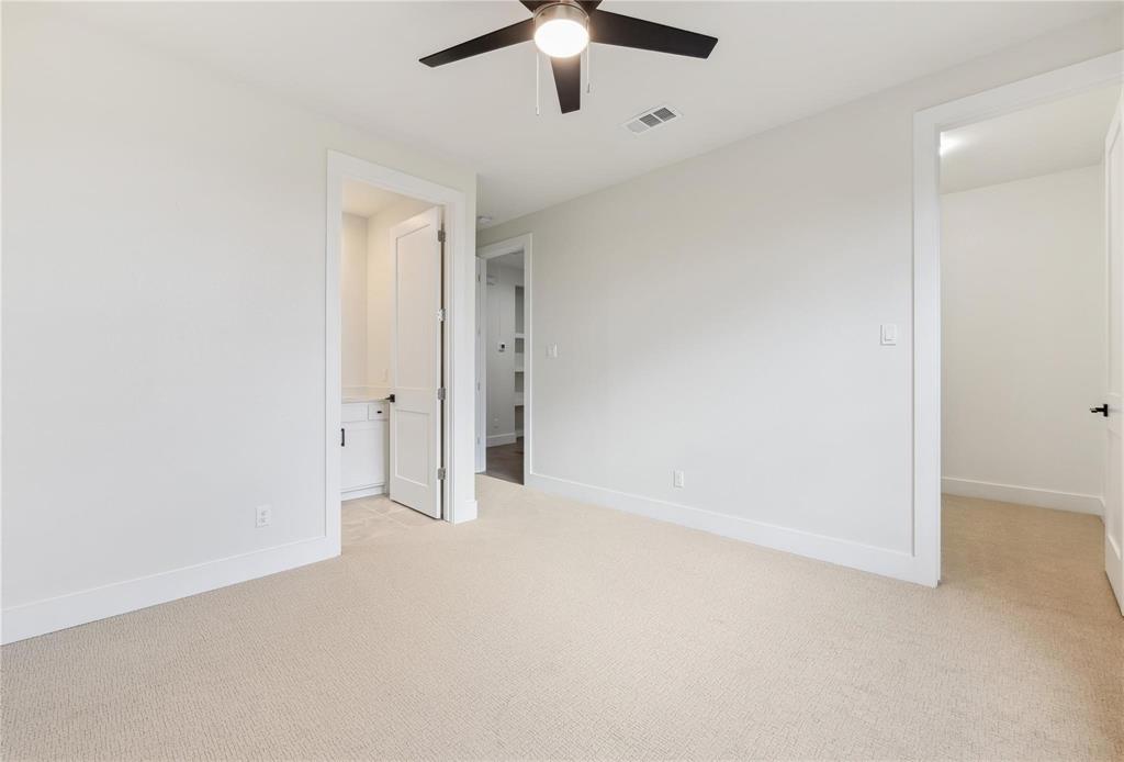 3230 Elihu Street, Unit 2 Dallas, TX 75210 - Photo 14 of 20 an empty room with chandelier fan