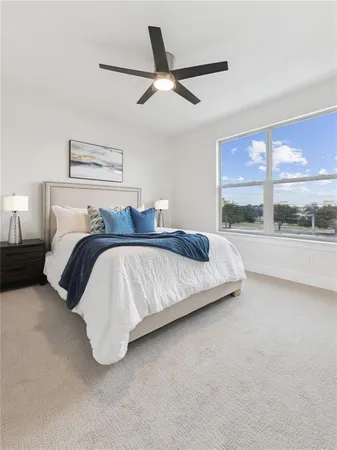 a bedroom with a bed and window