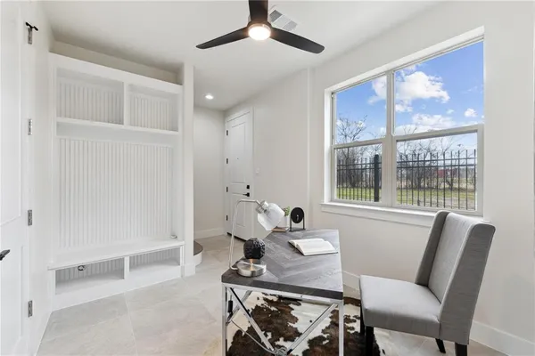 a dining room with furniture and window