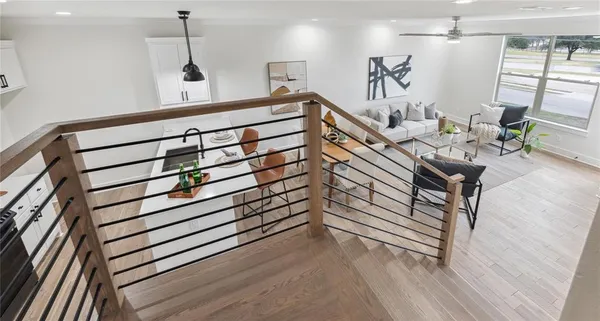 a view of entryway and hall with wooden floor