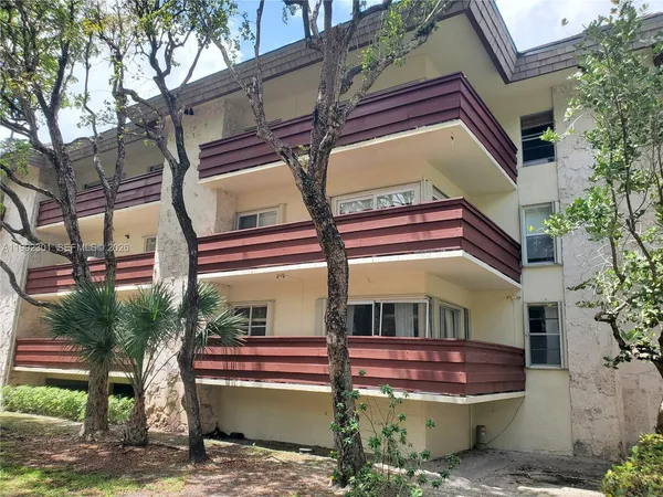 a view of house with outdoor space and sitting area