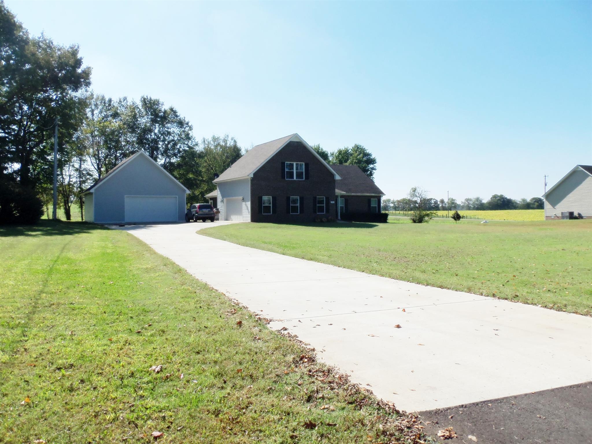 2960 Rossview Road Clarksville, TN 37043 - Photo 1 of 26 a large house with a big yard and large trees