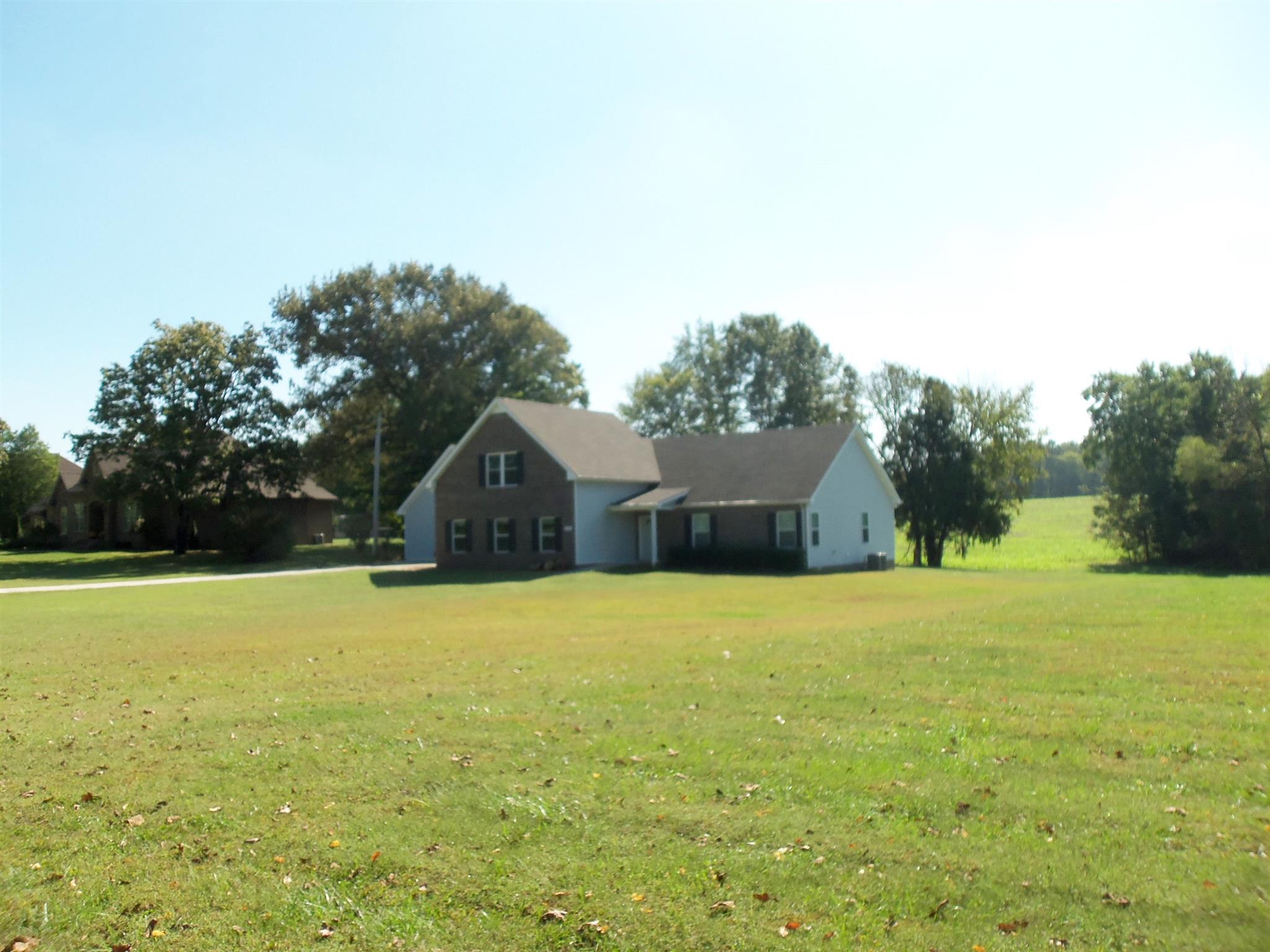 2960 Rossview Road Clarksville, TN 37043 - Photo 2 of 26 a tall house with a field