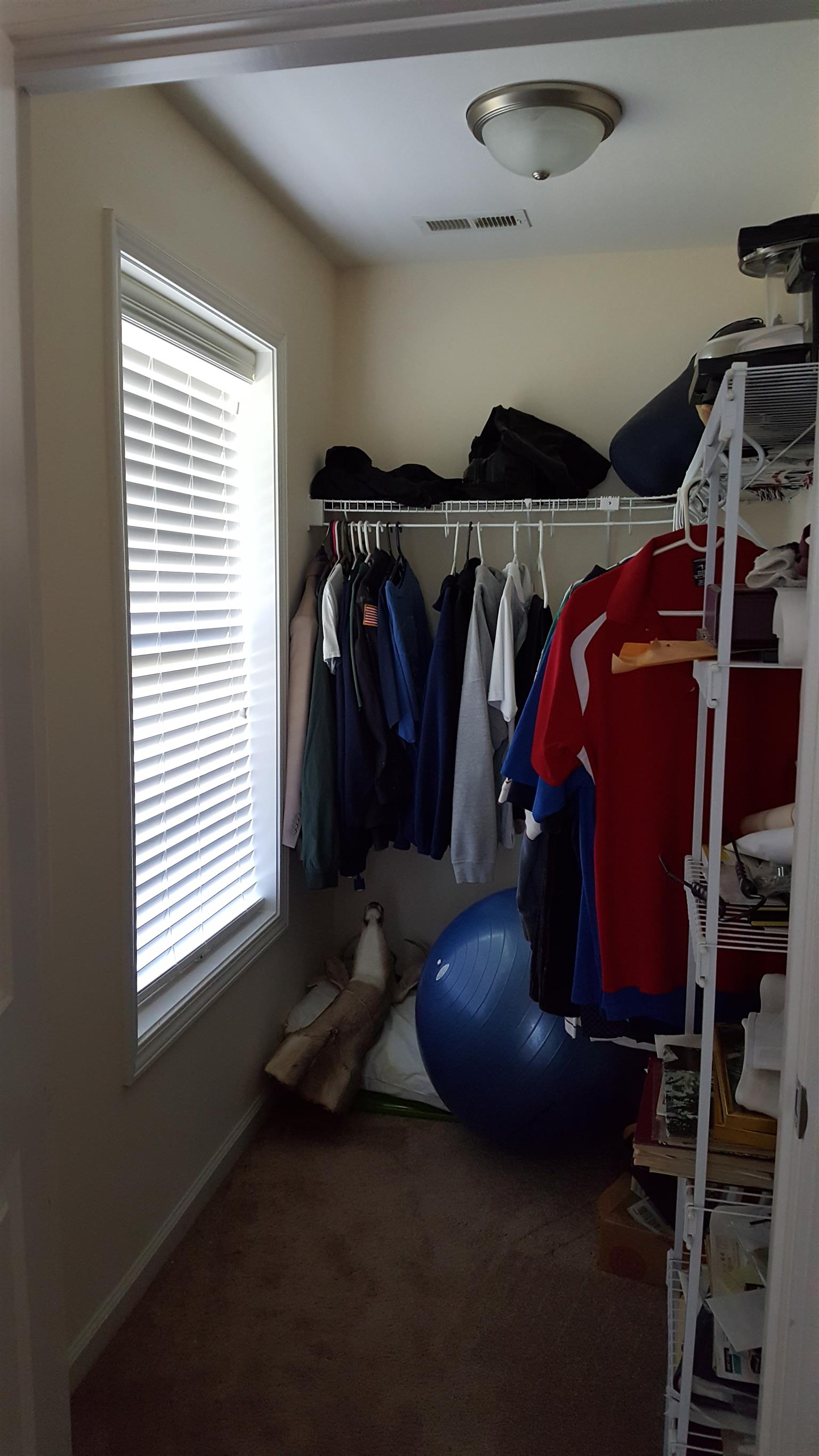2960 Rossview Road Clarksville, TN 37043 - Photo 20 of 26 a bed room with a bed and a window
