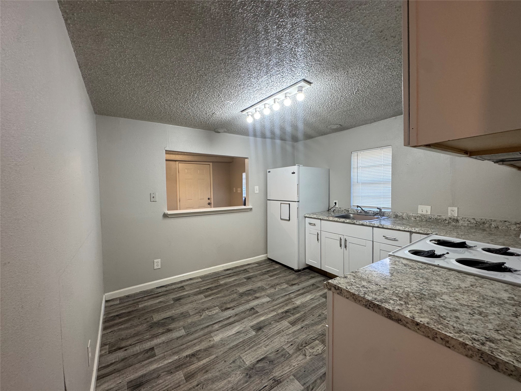 5007 Heflin Lane Austin, TX 78721 - Photo 7 of 25 A well-appointed kitchen features ample counter space and durable flooring.