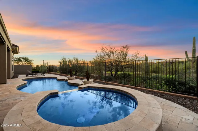 a view of swimming pool having outdoor seating