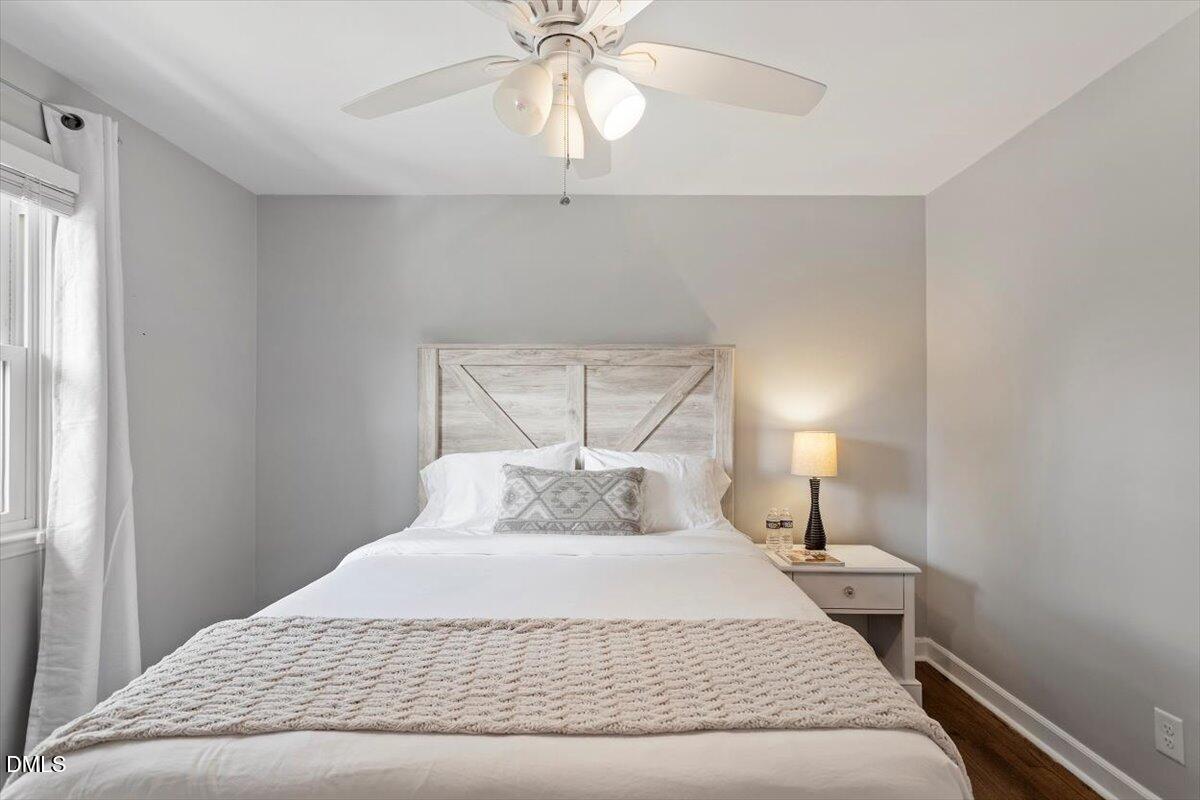 2120 Hillock Drive Raleigh, NC 27612 - Photo 22 of 29 a bedroom with a bed and window